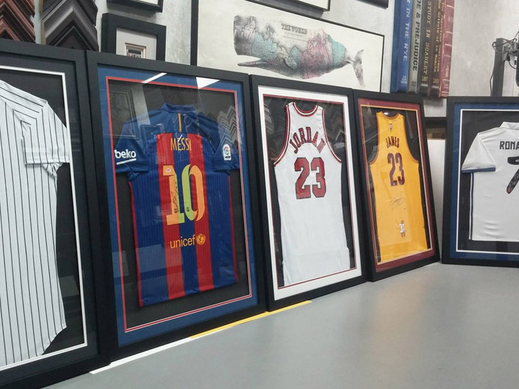 Sports jersey framing is difficult and very labor-intensive.